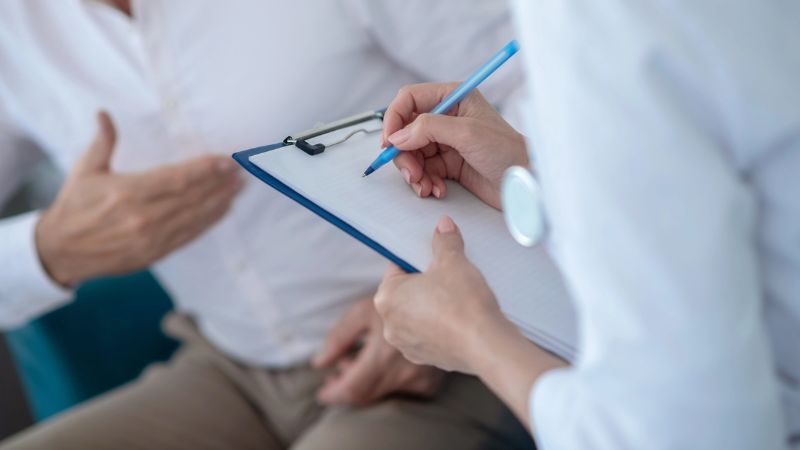 a medical provider taking notes