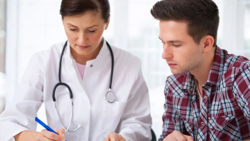 Doctor with male patient