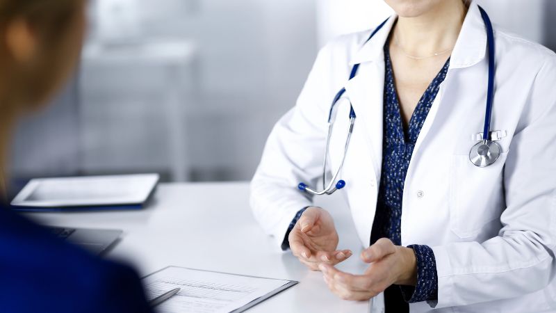 doctor is talking to her patient