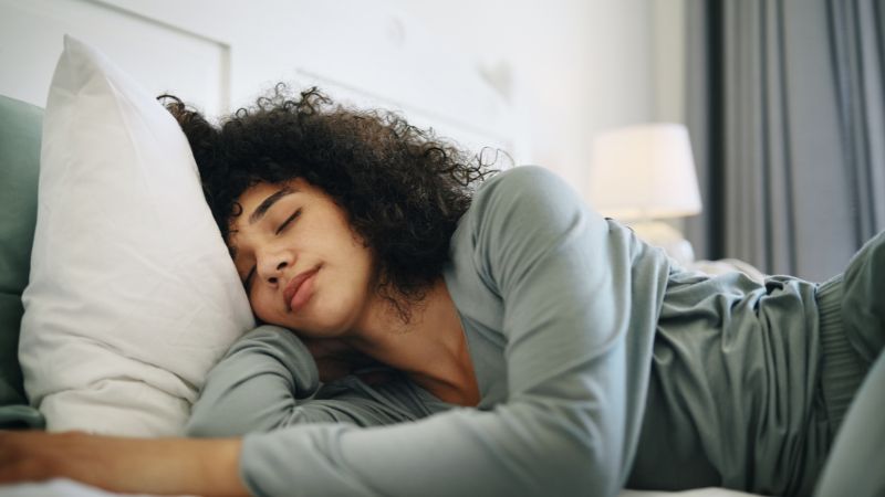 girl in home lying on pillow in apartment for wellness
