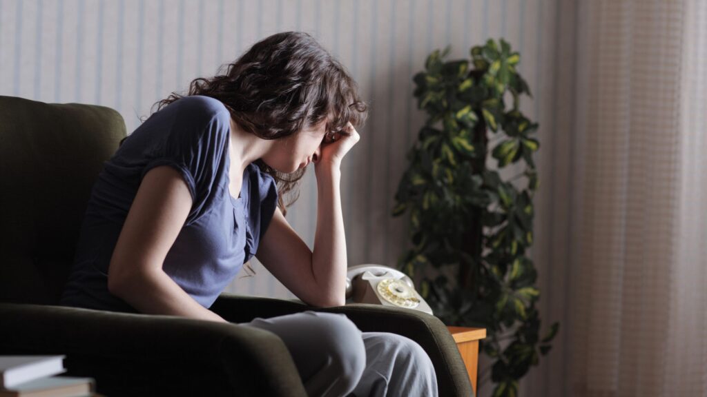 a woman suffering from depression visiting a tms clinic