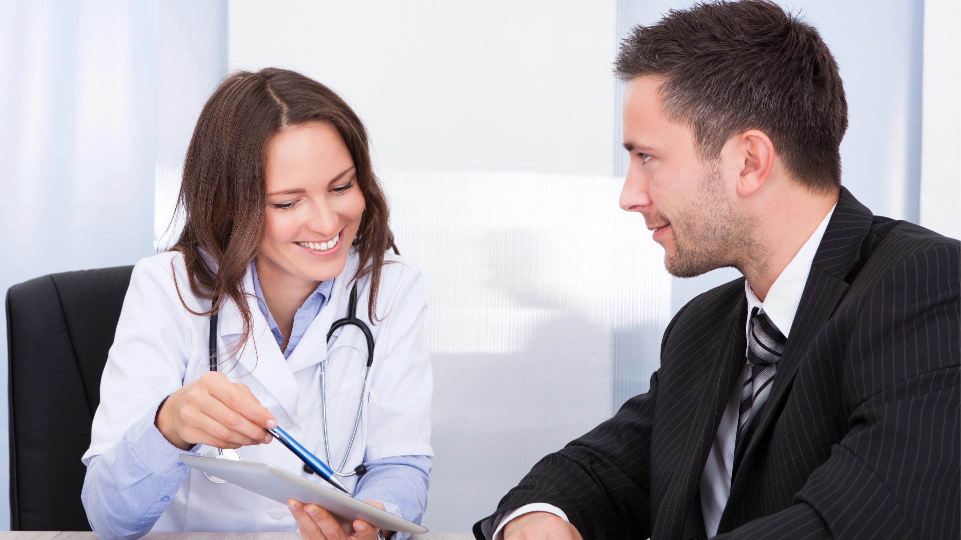 A doctor and patient at Mesa TMS Office
