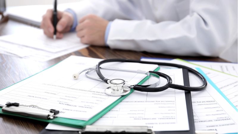 Clipboards with health insurance forms
