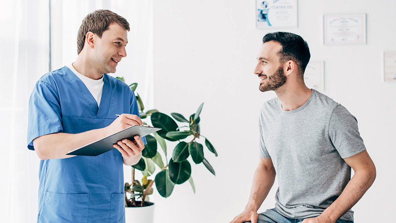 doctor and patient smiling on couch