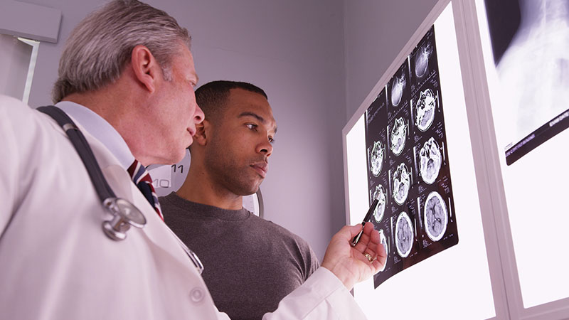 medical doctor reviewing x ray