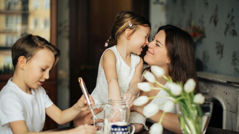 Woman Playing With Her Children