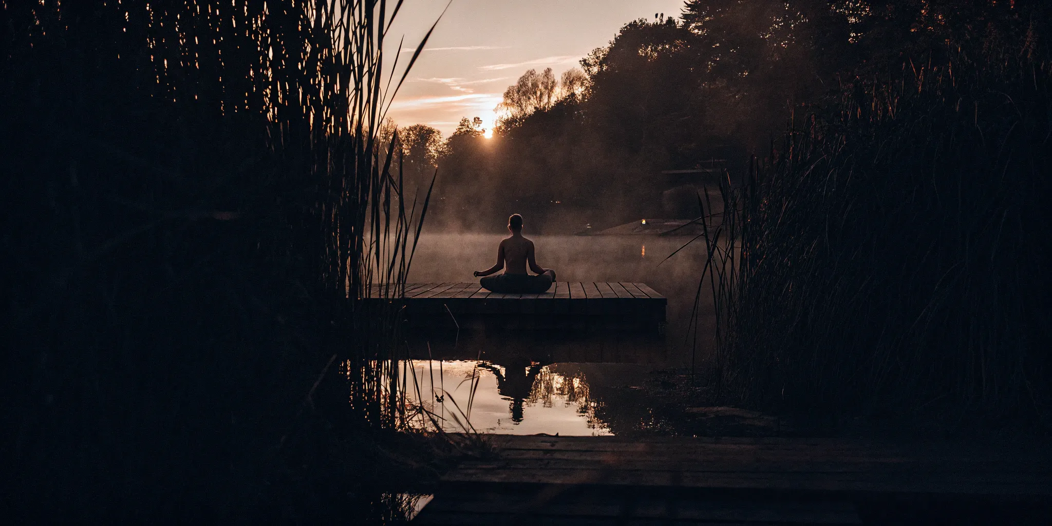 A person meditating outdoors for the best drug-free depression treatment.