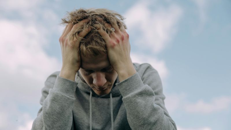anxious man with bruises on hands