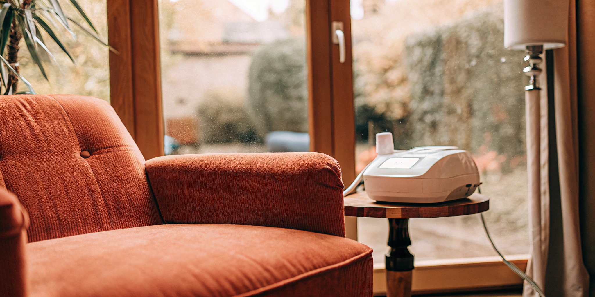 A safe, FDA-approved device for depression help on a table in a sunlit room.