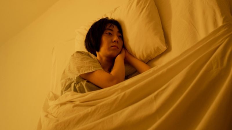 A Lonely Woman Lying on Bed