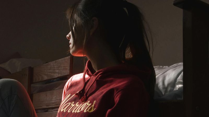 Woman Sitting On Floor