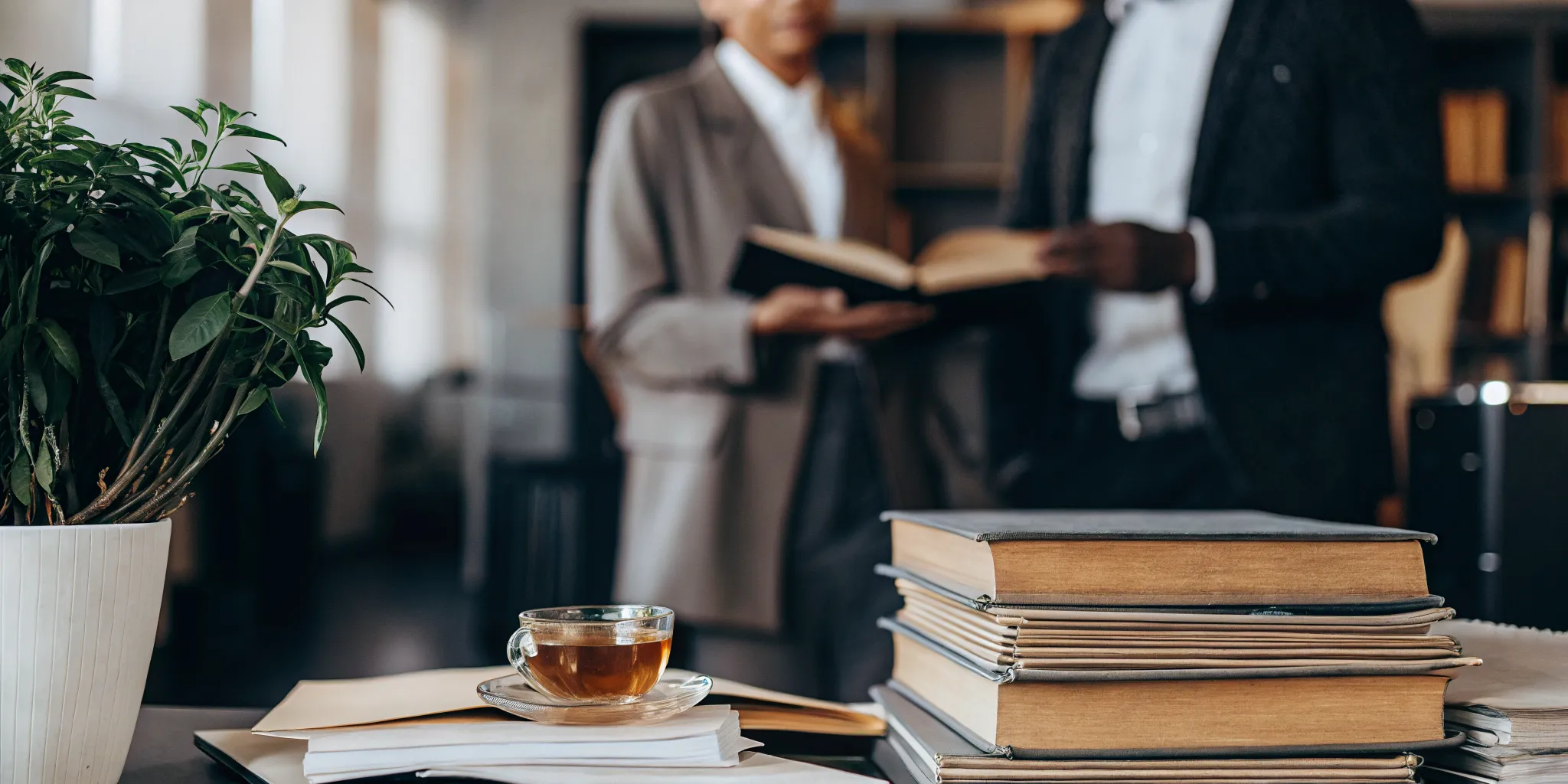 Two people at a desk discussing the OCD treatment of choice.