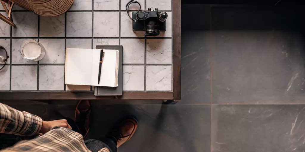 A journal and pen for exploring non-pharmacological treatment for depression.