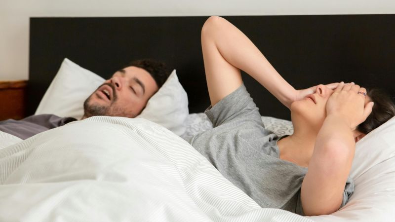 A Woman Trying to Sleep while Her Husband is Snoring