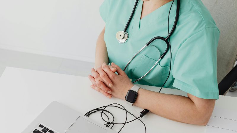 a doctor using a laptop