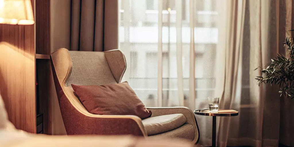 Comfortable armchair in a calm room for a psychiatric evaluation for depression.
