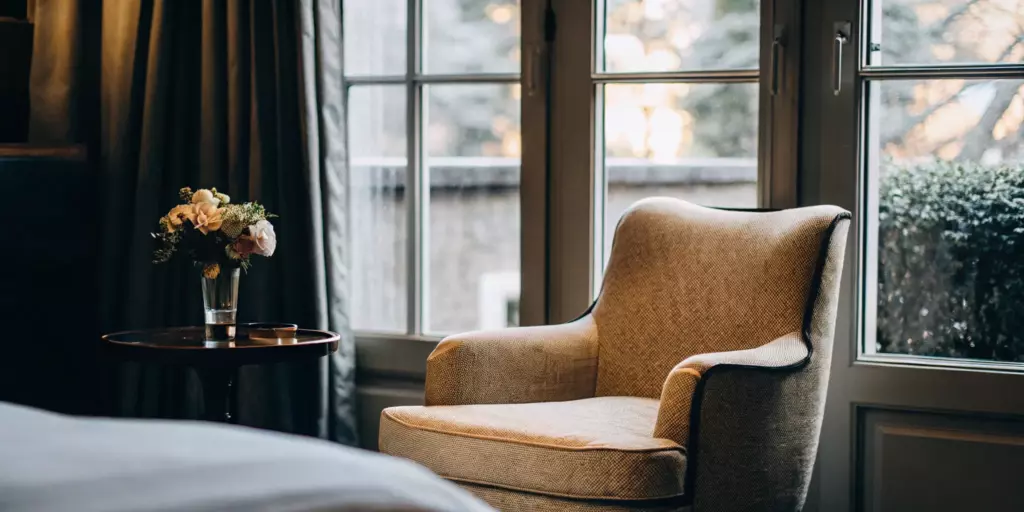 A peaceful room with an armchair, a calm setting for understanding allopathic treatment for OCD.