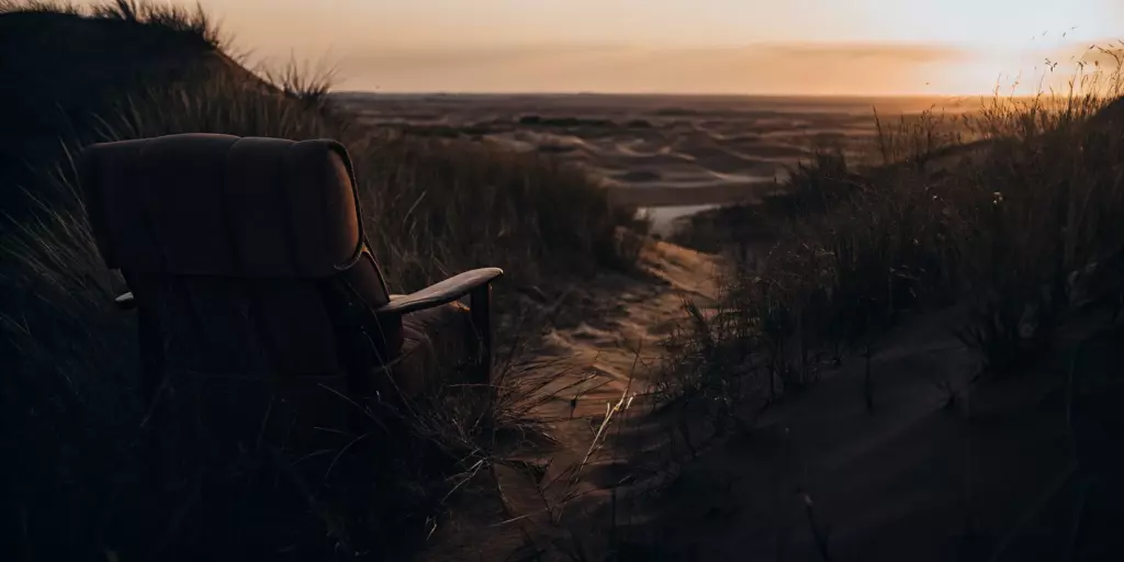 Peaceful sunset over sand dunes.