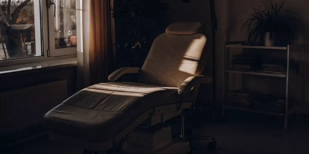 A clinical TMS therapy chair, a place to consider the side effects and disadvantages of treatment.
