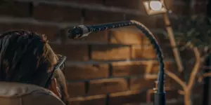 Man receiving transcranial magnetic stimulation therapy as a device sends gentle magnetic pulses to his brain.