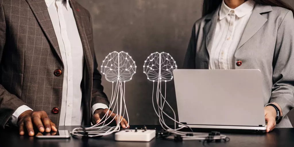 Clinicians review brain scans while applying non-invasive brain stimulation techniques.
