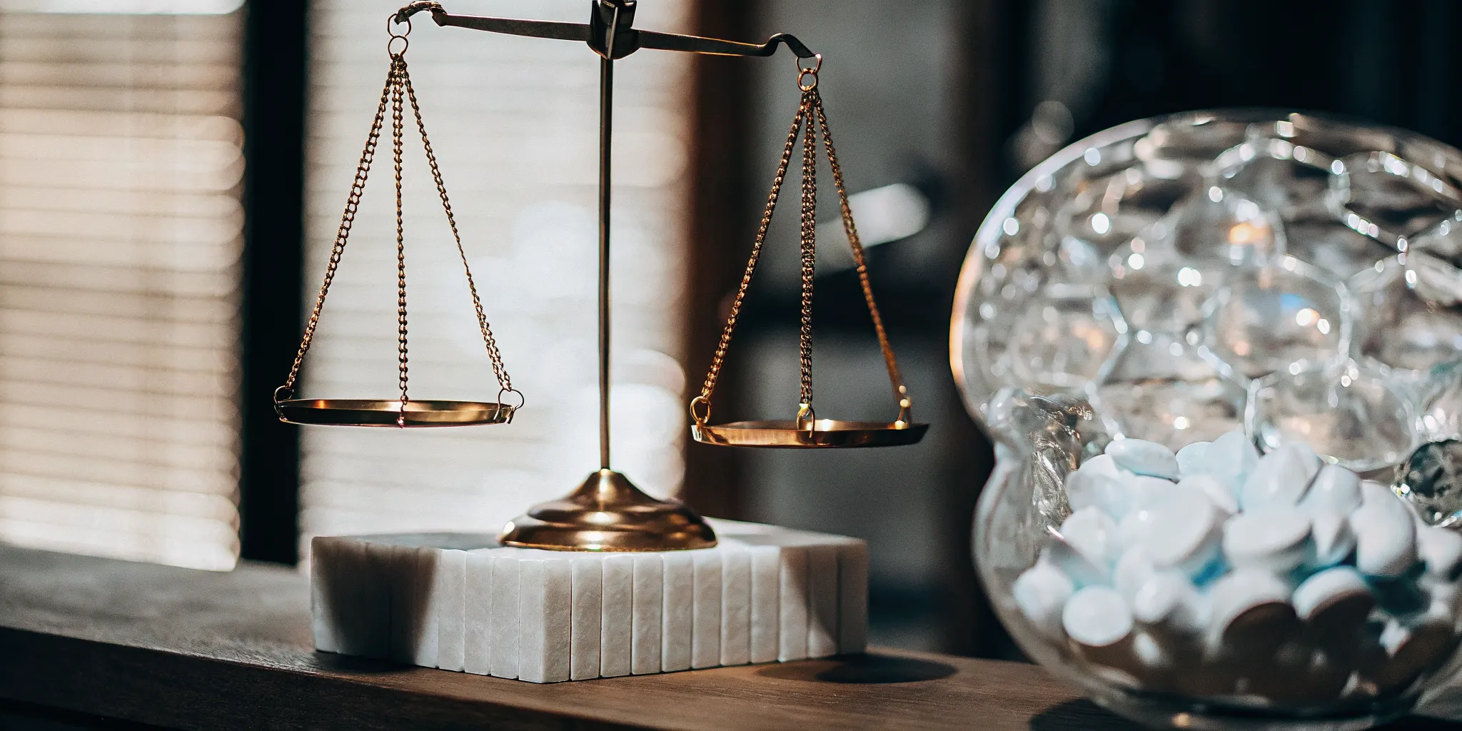 A balance scale with pills, weighing the side effects of mental health medication.