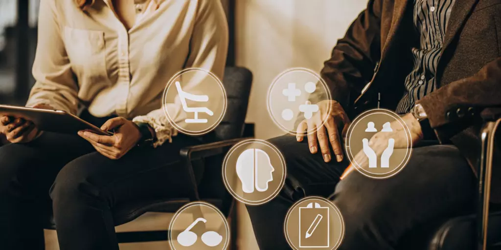 A patient and clinician discussing the cost of TMS for OCD.