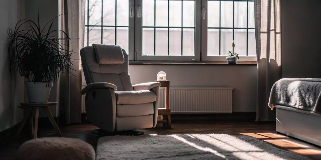 A calm room with a comfortable chair for a patient following the TMS anxiety protocol.