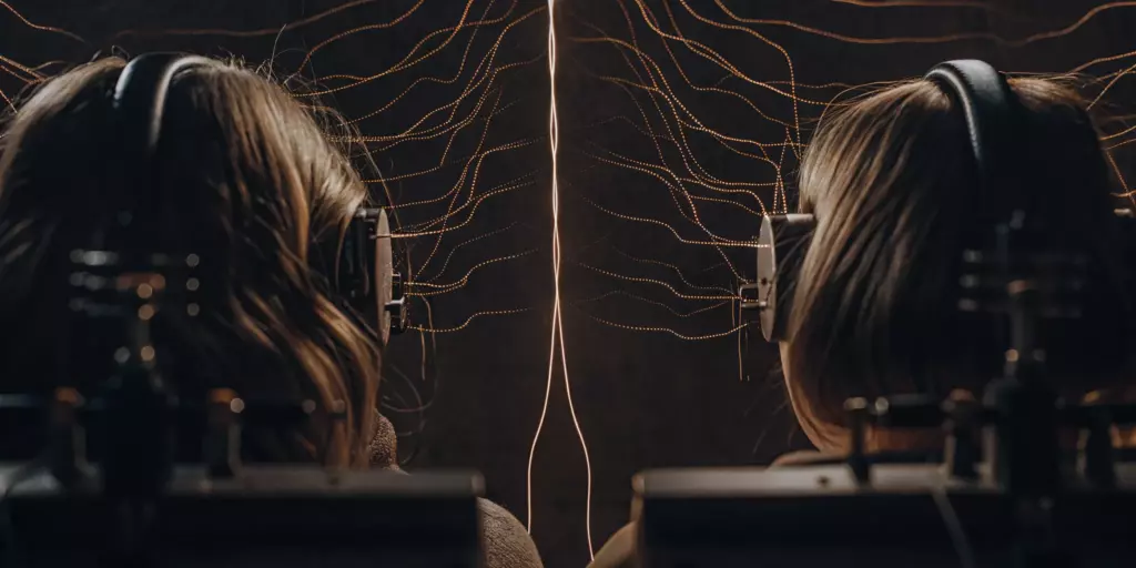 A patient and doctor comparing theta burst stimulation vs TMS therapy treatment options.
