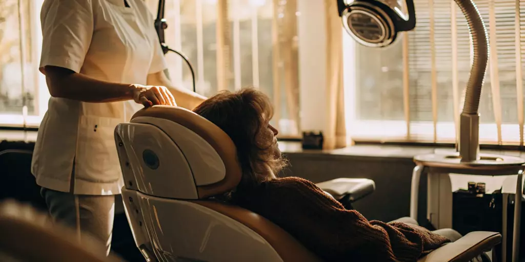 Patient receiving TMS therapy for OCD in a comfortable treatment chair.