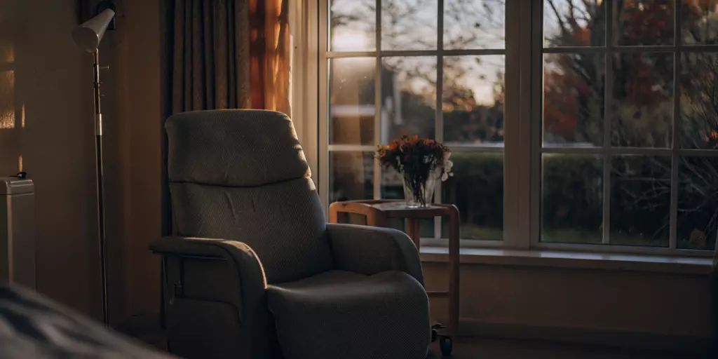 A comfortable chair in a calm treatment room for TMS therapy for anxiety.