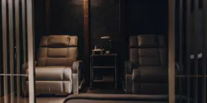 A clinical treatment room with chairs used to compare the effectiveness of TMS vs ECT for depression.