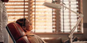 Patient receiving repetitive transcranial magnetic stimulation treatment for depression.