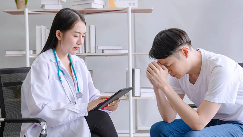 young doctor psychologist working tablet see reports