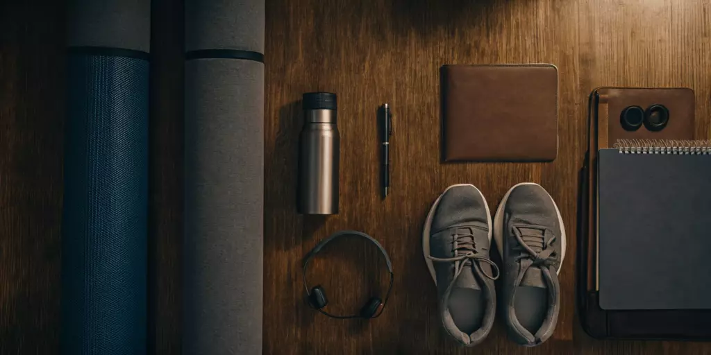 Yoga mat, sneakers, and a journal as tools for non-medication depression treatment.